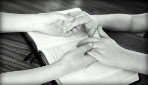Praying - holding hands